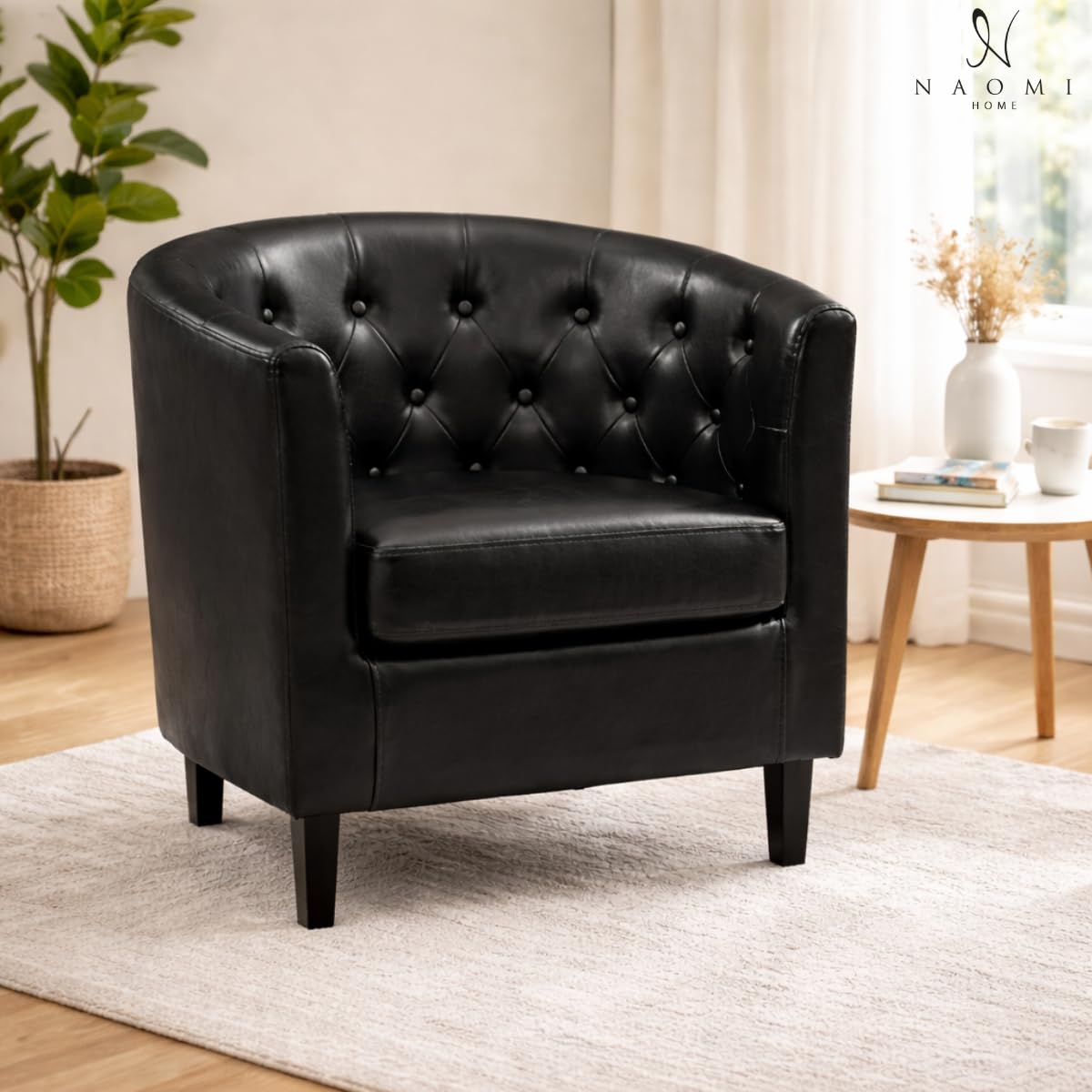 Emma button tufted faux leather barrel accent chair black